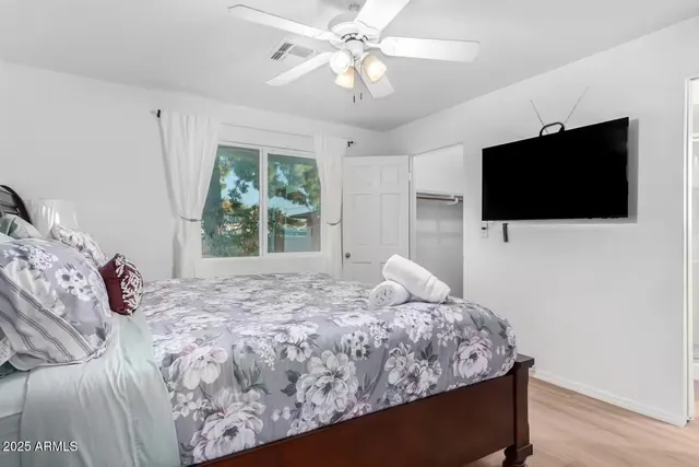 a bedroom with furniture and a staircase