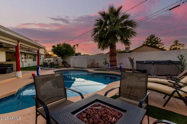 a view of a swimming pool with a patio