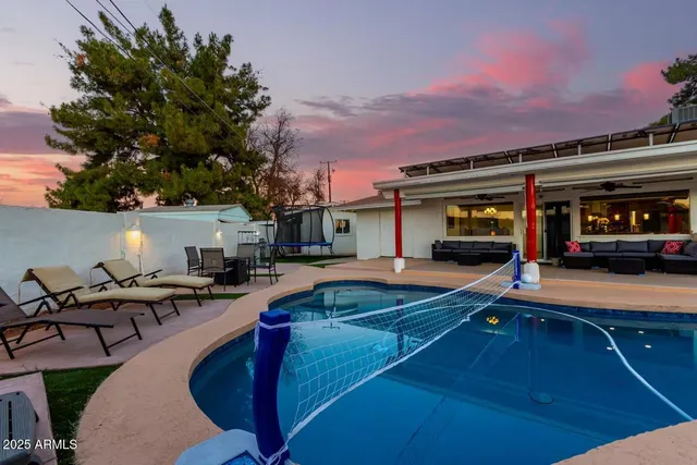 a view of a car park in front of the house