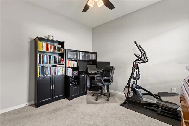 a view of a workspace with furniture