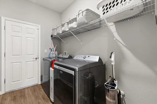 a utility room with dryer and washer