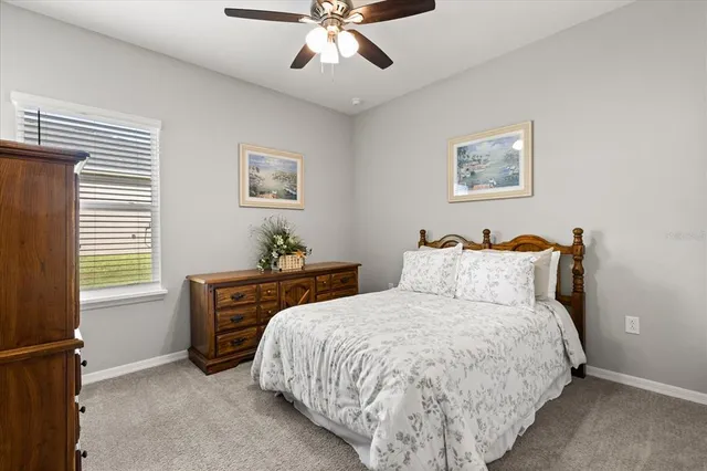 a bedroom with bed and window