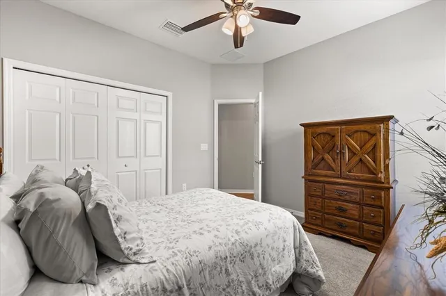 a bedroom with a bed and closet