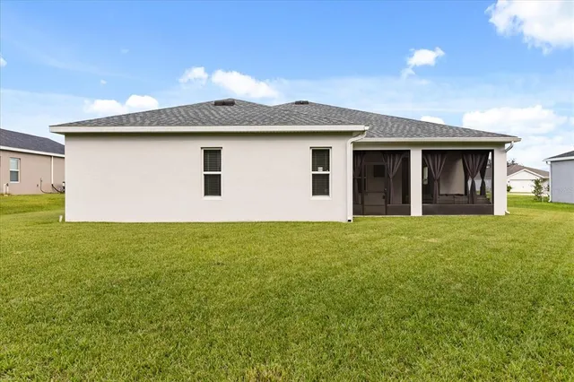 a front view of house with yard and garage