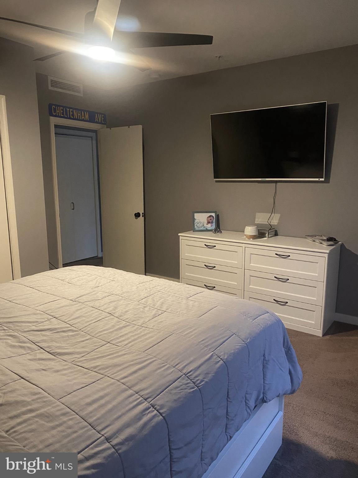 1600 Church Road, Unit B213 Wyncote, PA 19095 - Photo 11 of 25 a bedroom with a bed and a flat screen tv