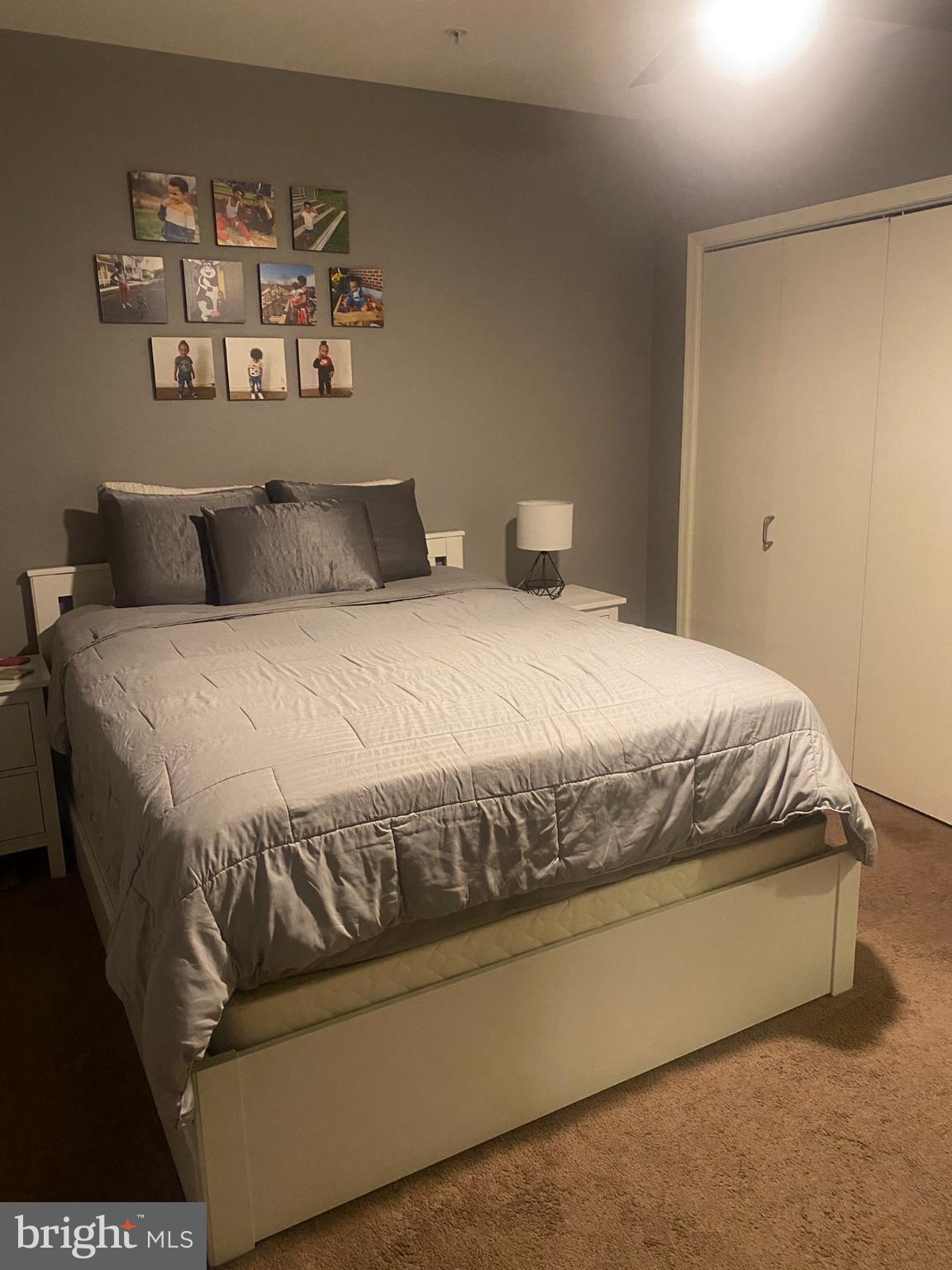 1600 Church Road, Unit B213 Wyncote, PA 19095 - Photo 15 of 25 a bedroom with a bed and wall painting