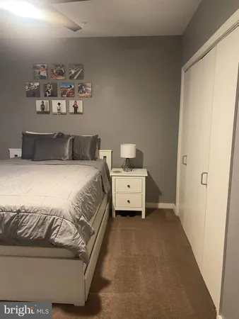 a bedroom with a bed and wall painting