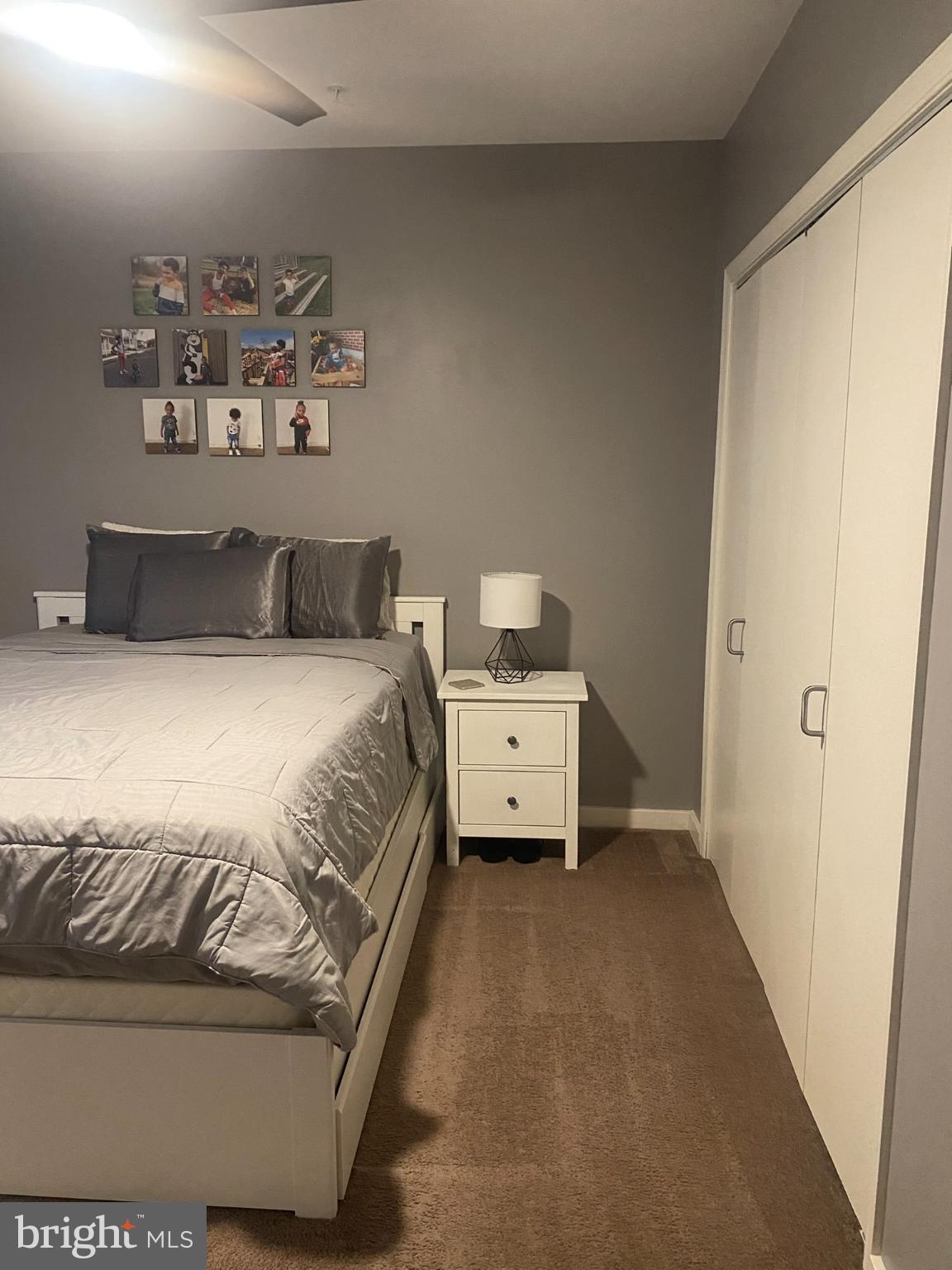 1600 Church Road, Unit B213 Wyncote, PA 19095 - Photo 19 of 25 a bedroom with a bed and cabinets