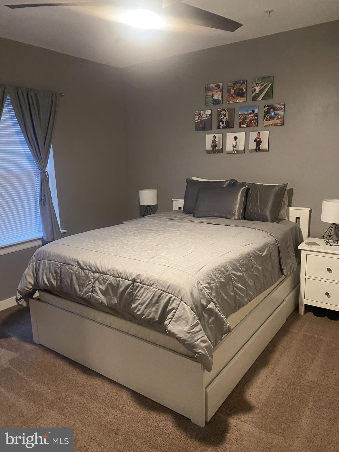 1600 Church Road, Unit B213 Wyncote, PA 19095 - Photo 20 of 25 a bedroom with a bed and wall painting