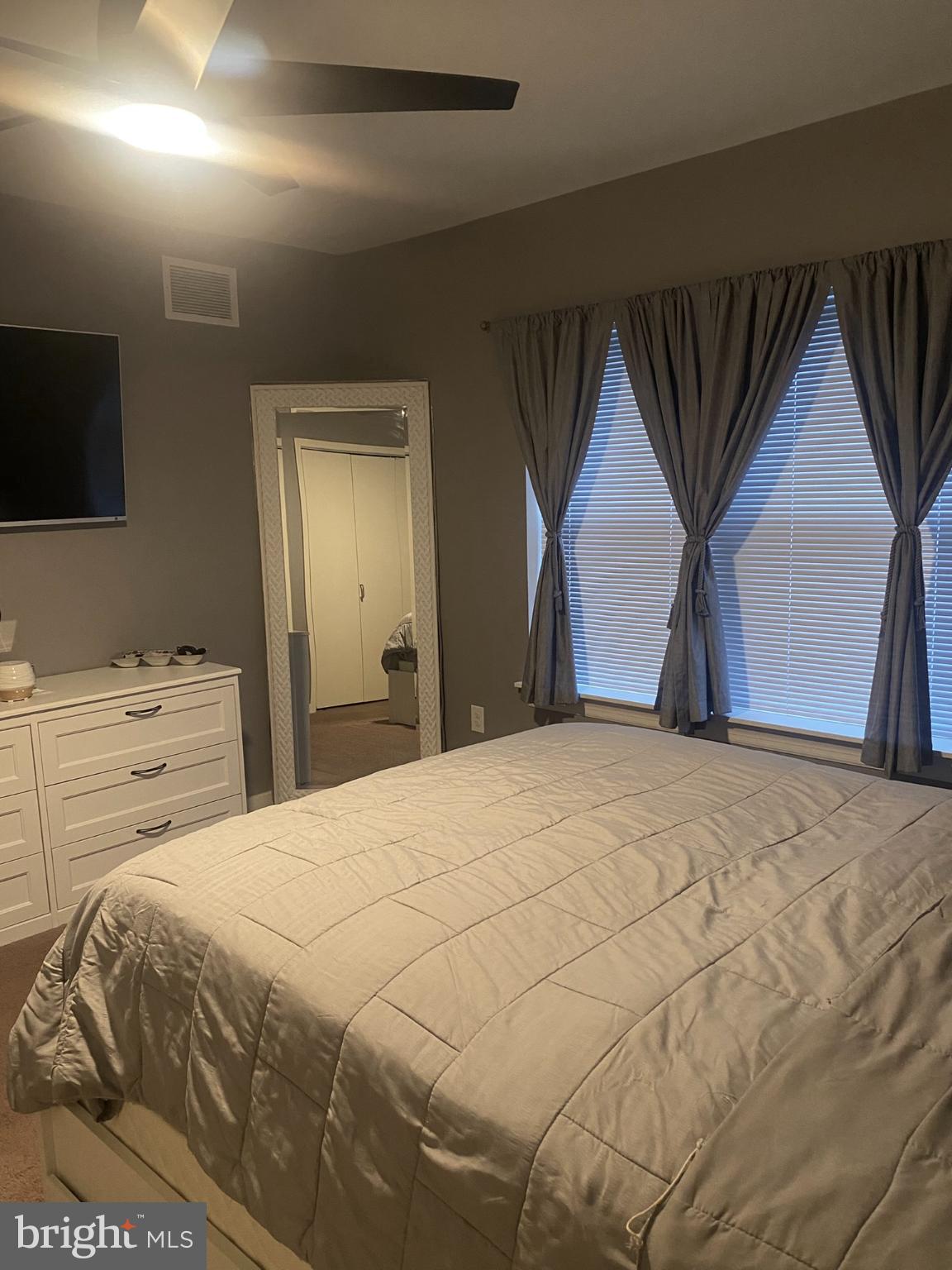 1600 Church Road, Unit B213 Wyncote, PA 19095 - Photo 21 of 25 a bedroom with a bed and a television