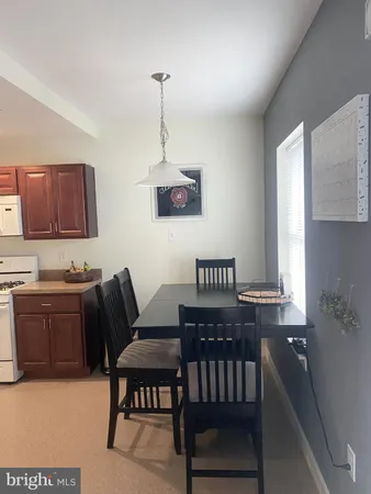 a view of a livingroom with furniture window and wooden floor