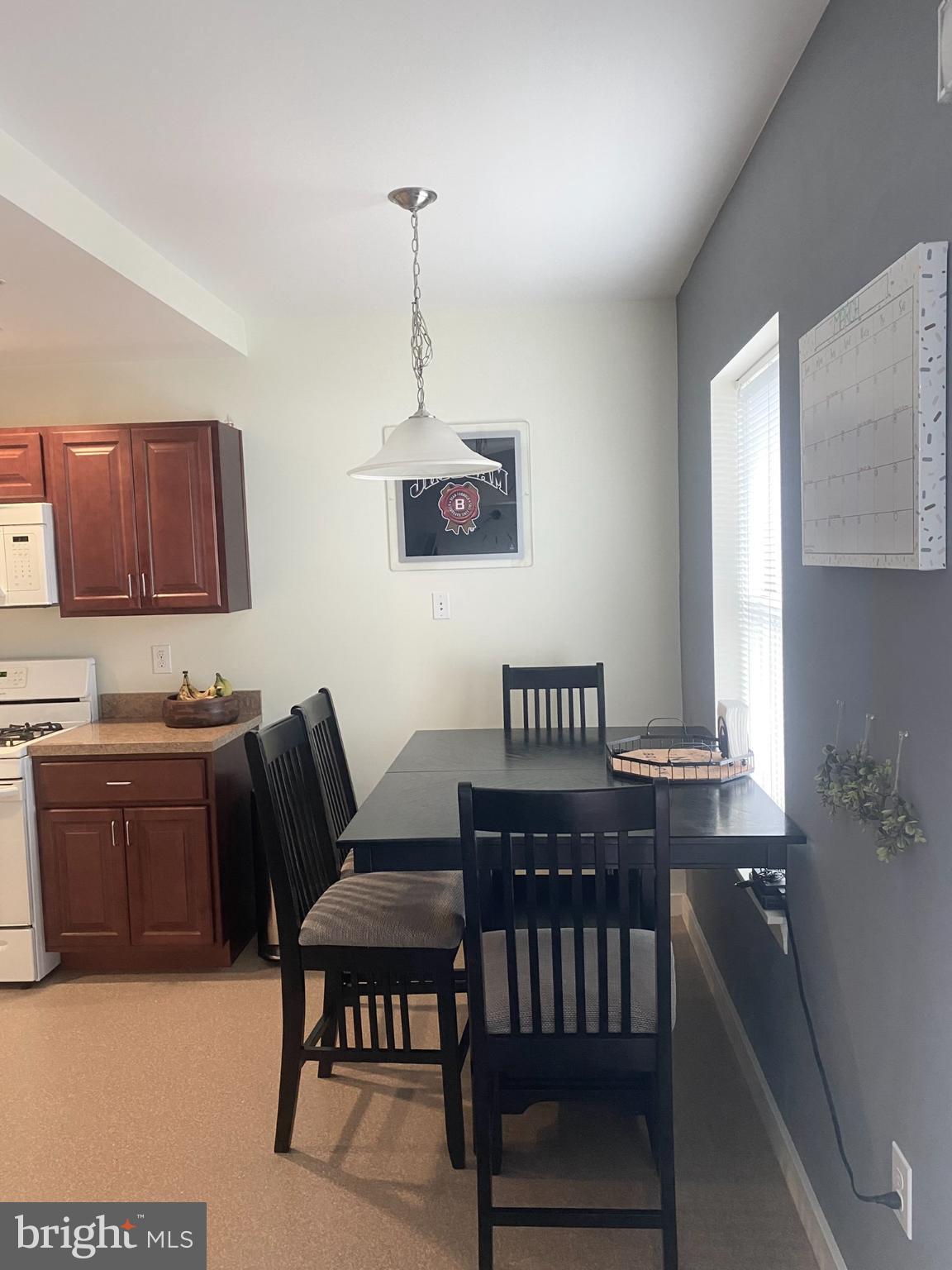 1600 Church Road, Unit B213 Wyncote, PA 19095 - Photo 3 of 25 a view of a livingroom with furniture window and wooden floor