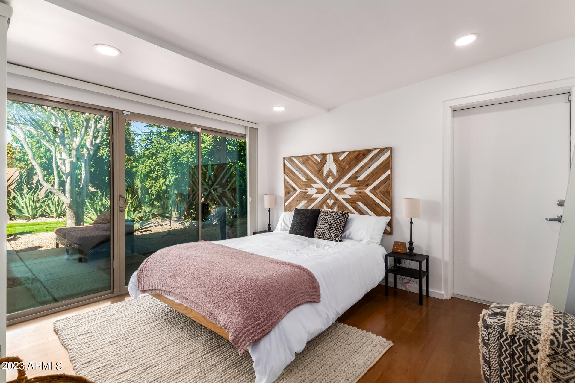 5018 North 71st Place Paradise Valley, AZ 85253 - Photo 15 of 22 a bedroom with a bed and a floor to ceiling window