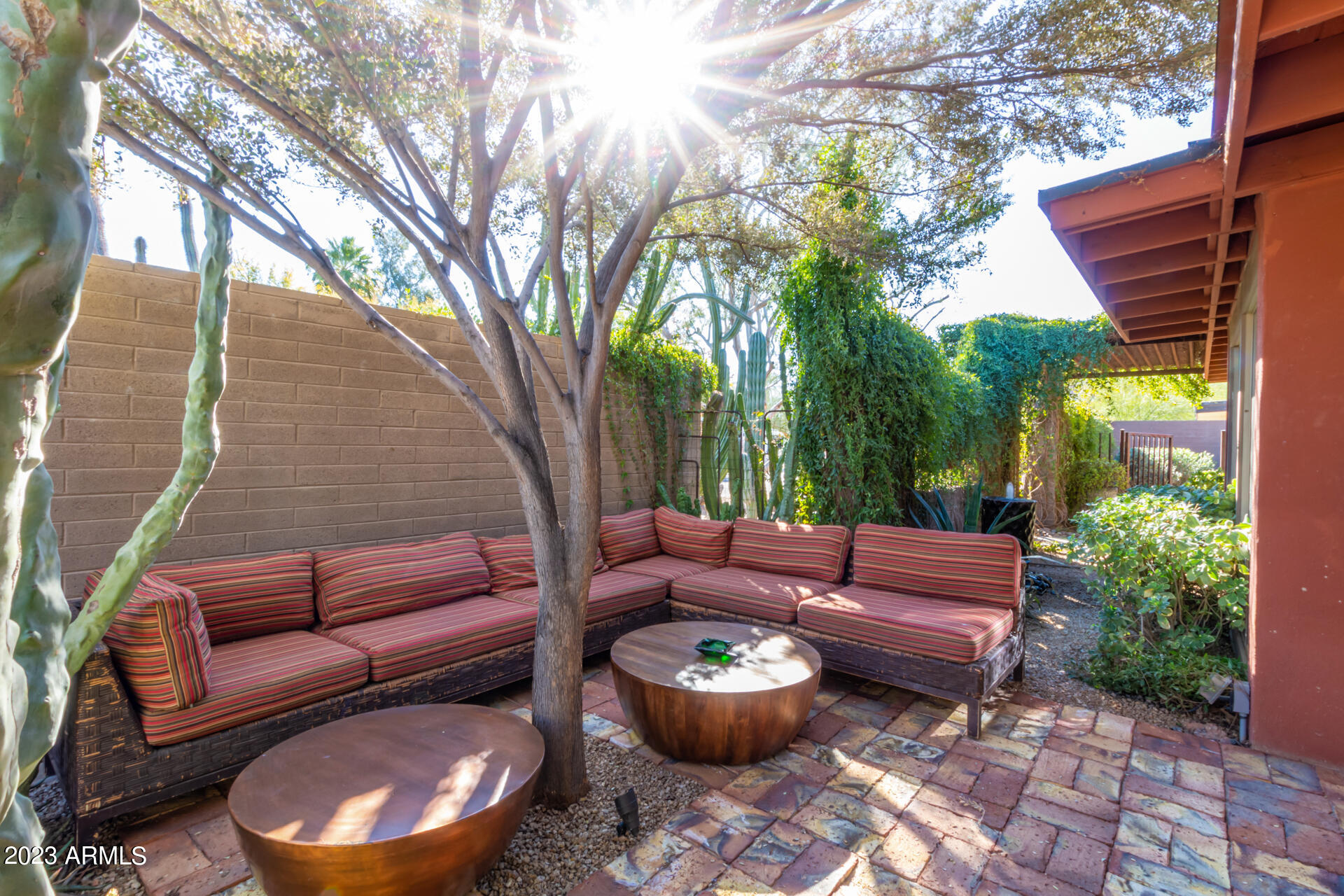 5018 North 71st Place Paradise Valley, AZ 85253 - Photo 17 of 22 a outdoor space with patio couches and a potted plant
