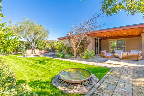 a view of a swimming pool with a backyard