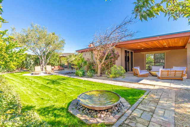 a view of a swimming pool with a backyard