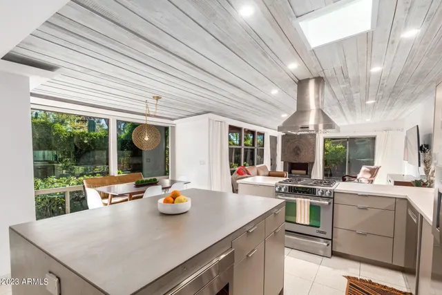 a kitchen with a sink appliances and cabinets