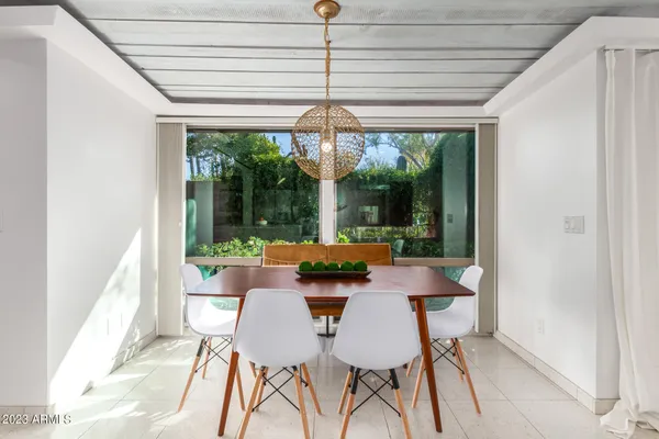 a view of a dining room with furniture window and outside view