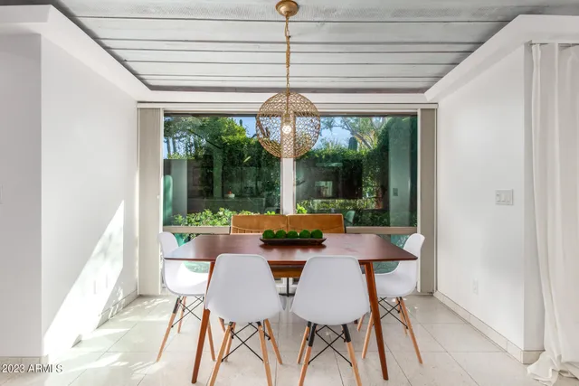 a view of a dining room with furniture window and outside view