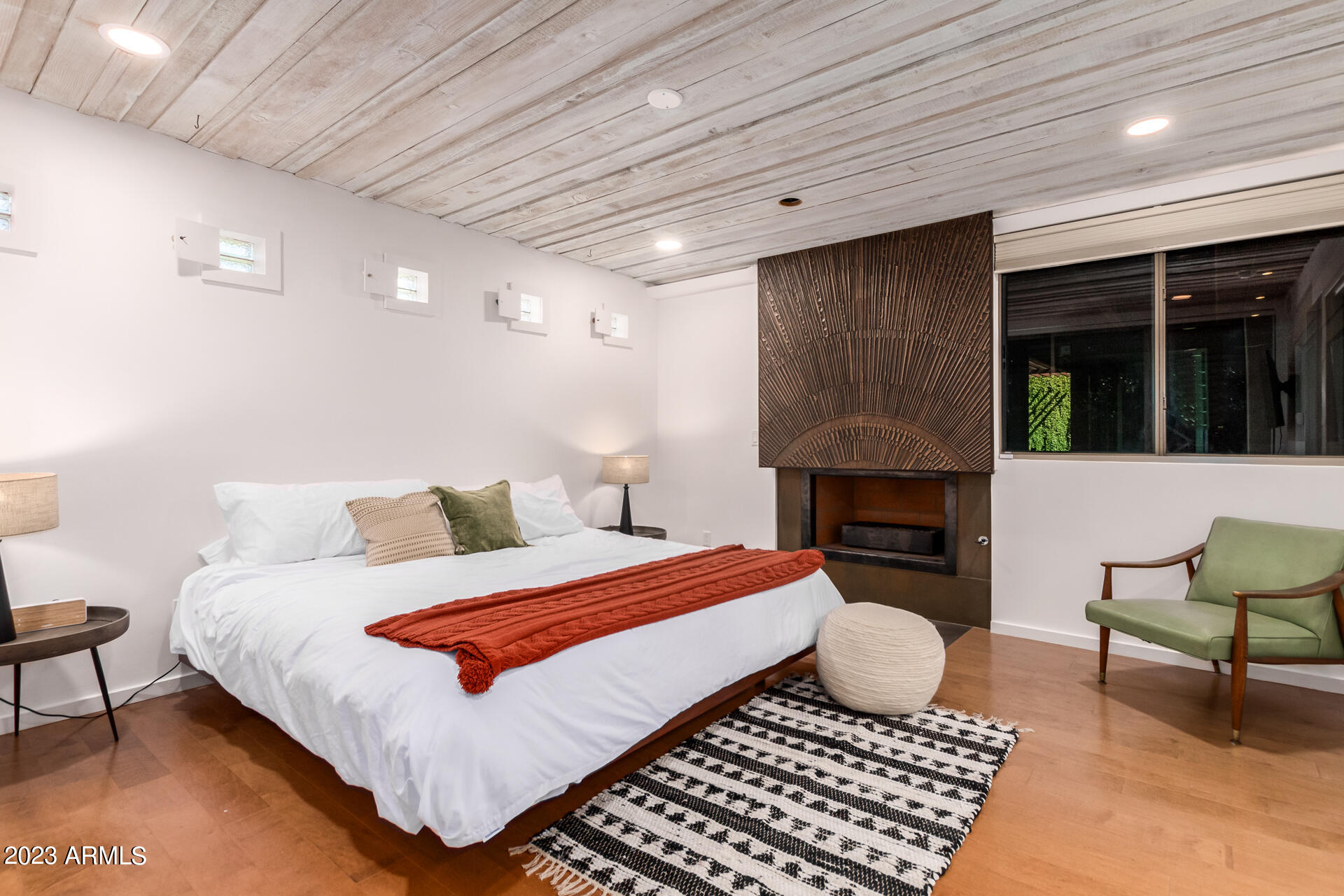 5018 North 71st Place Paradise Valley, AZ 85253 - Photo 10 of 22 a bedroom with a bed and a fireplace