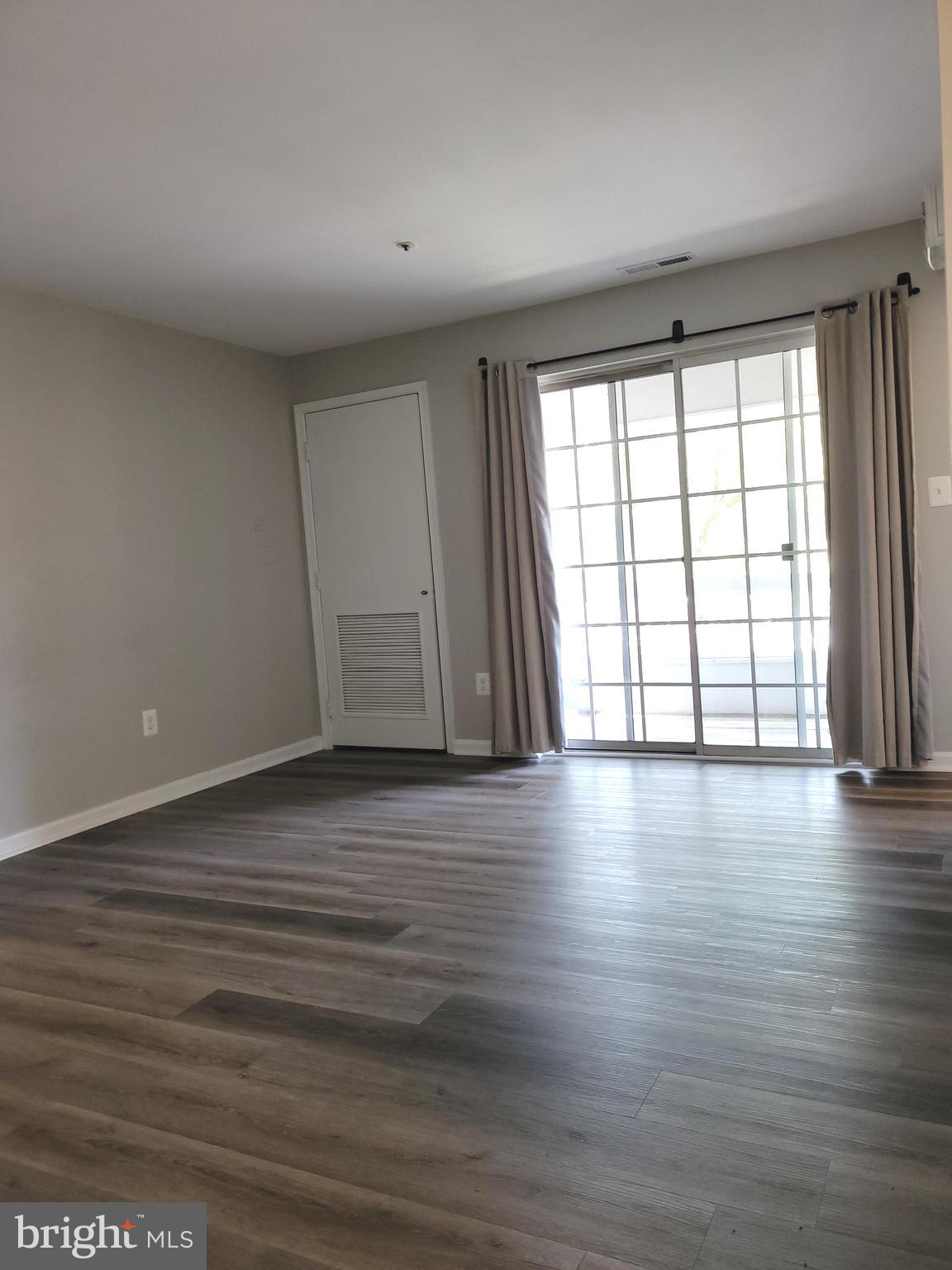 8360 Montgomery Run Road, Unit H Ellicott City, MD 21043 - Photo 12 of 28 Living Room to Balcony