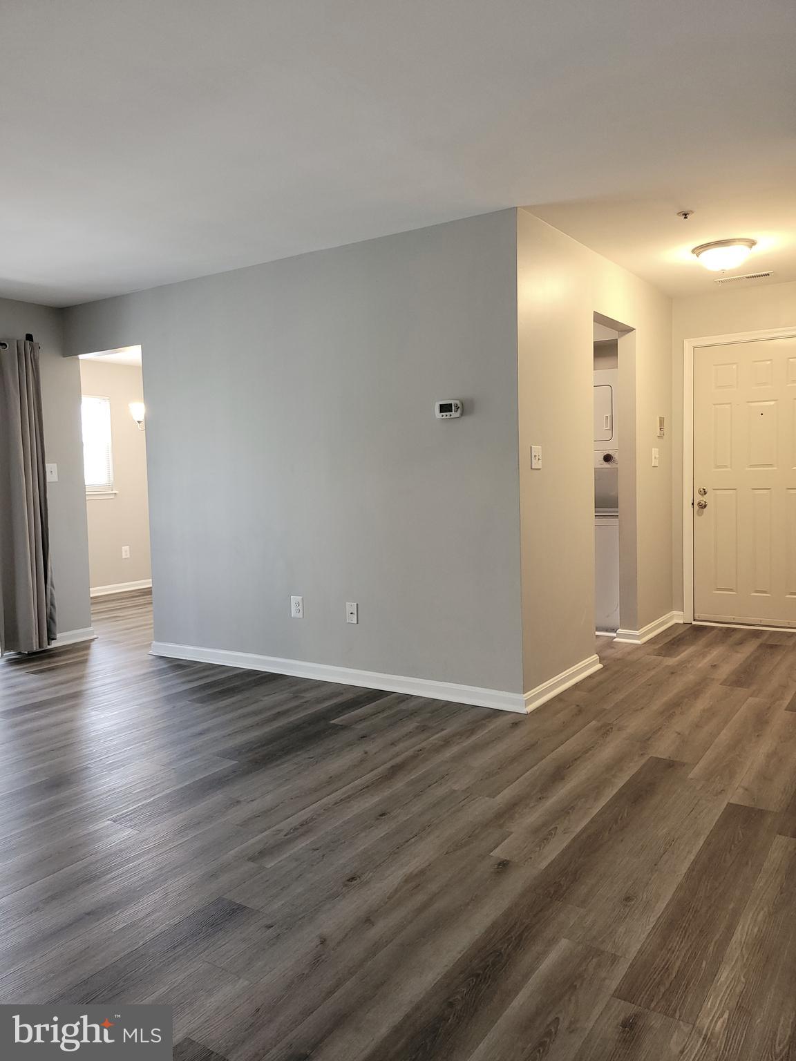 8360 Montgomery Run Road, Unit H Ellicott City, MD 21043 - Photo 10 of 28 Living Room to Foyer and Kitchen