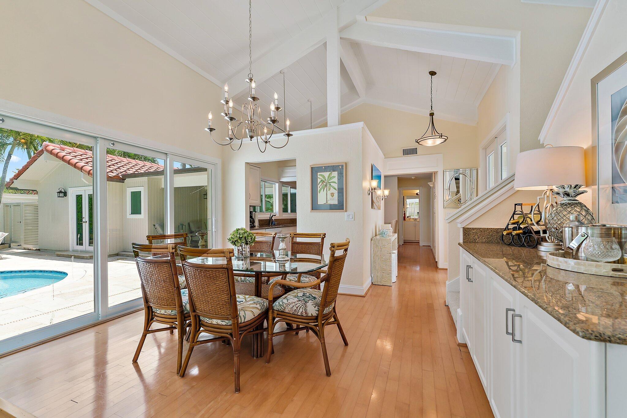 107 Mako Lane Jupiter, FL 33477 - Photo 5 of 41 a view of a dining room with furniture window and wooden floor