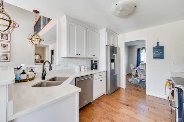 a kitchen with a sink and a microwave
