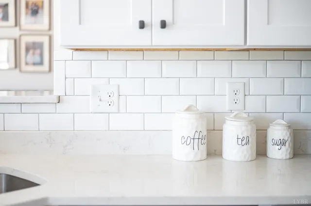 a bathroom with a sink and a window