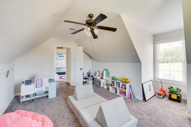 a view of a backyard with sitting area