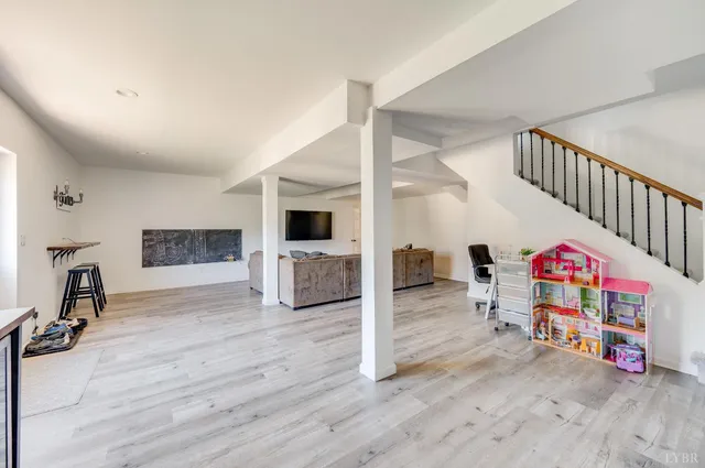 a view of balcony with wooden floor and fence