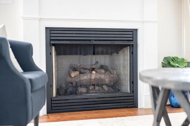 a kitchen with a sink cabinets and wooden floor