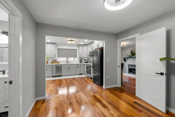 a kitchen with a refrigerator and a sink