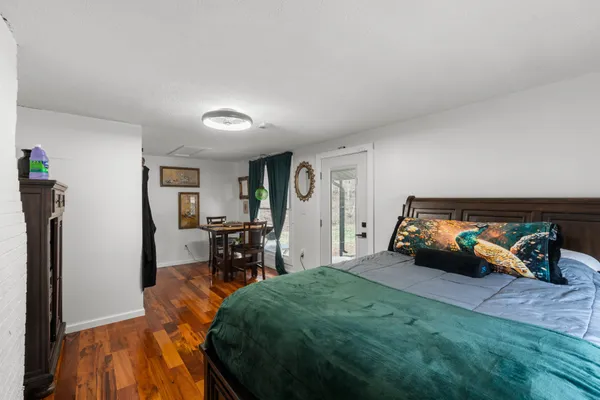 a bed room with a bed and a chair