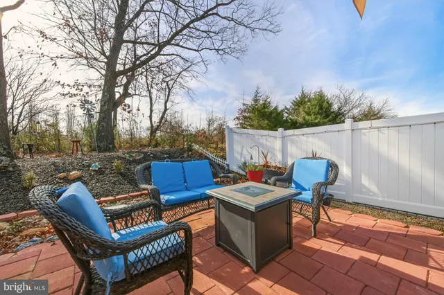 a view of a chairs and table in the patio