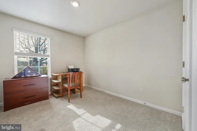 a work room with furniture and windows