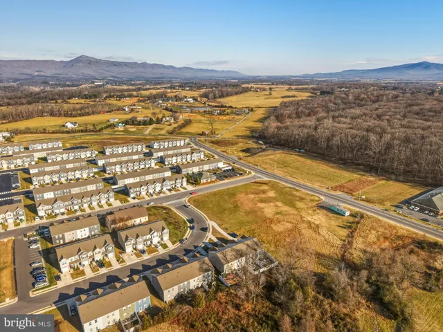 an aerial view of houses with outdoor space