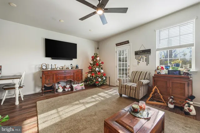 a room with furniture and a flat screen tv