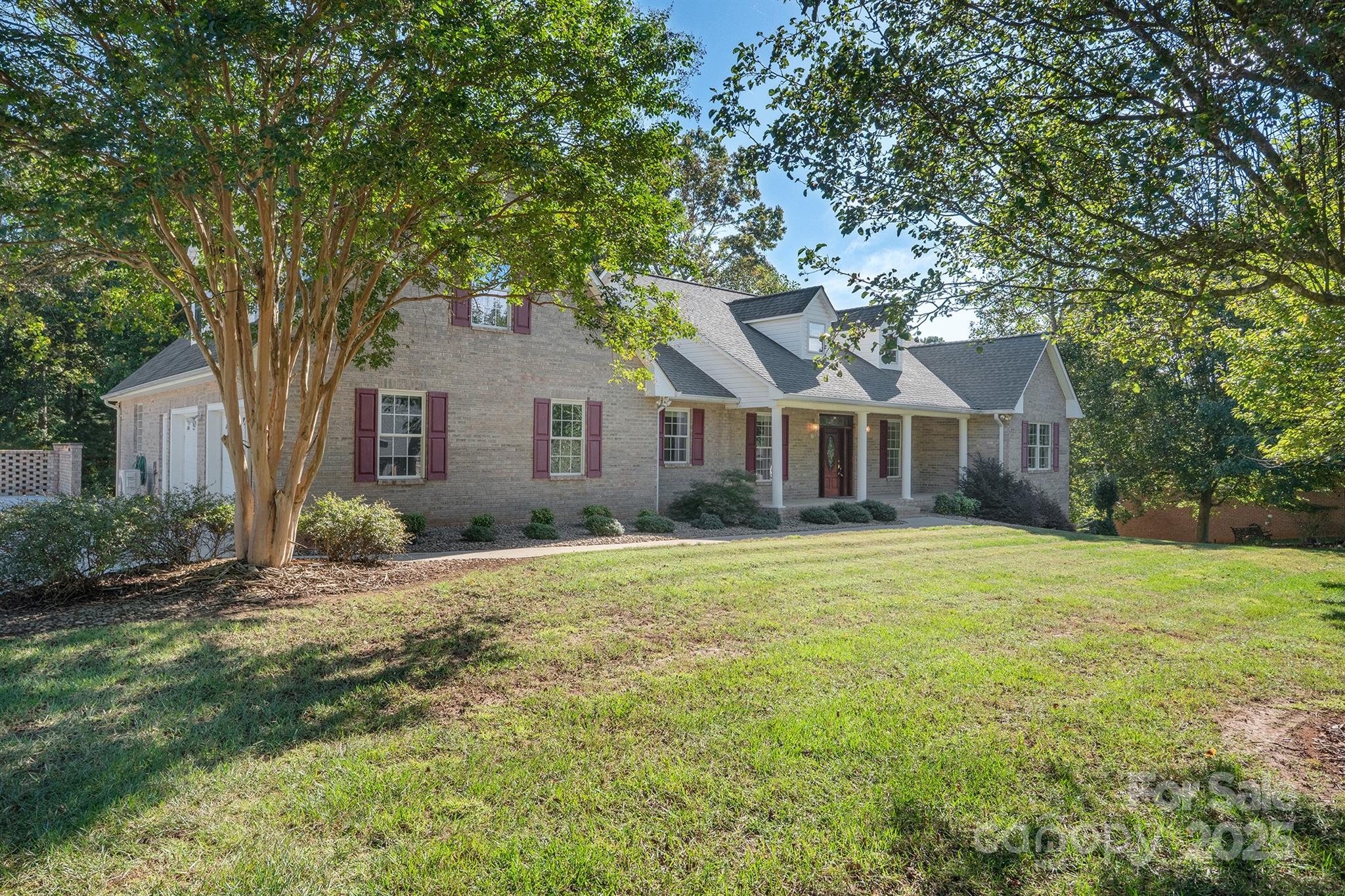 5350 Beacon Ridge Drive Granite Falls, NC 28630 - Photo 3 of 48 a front view of a house with yard and green space