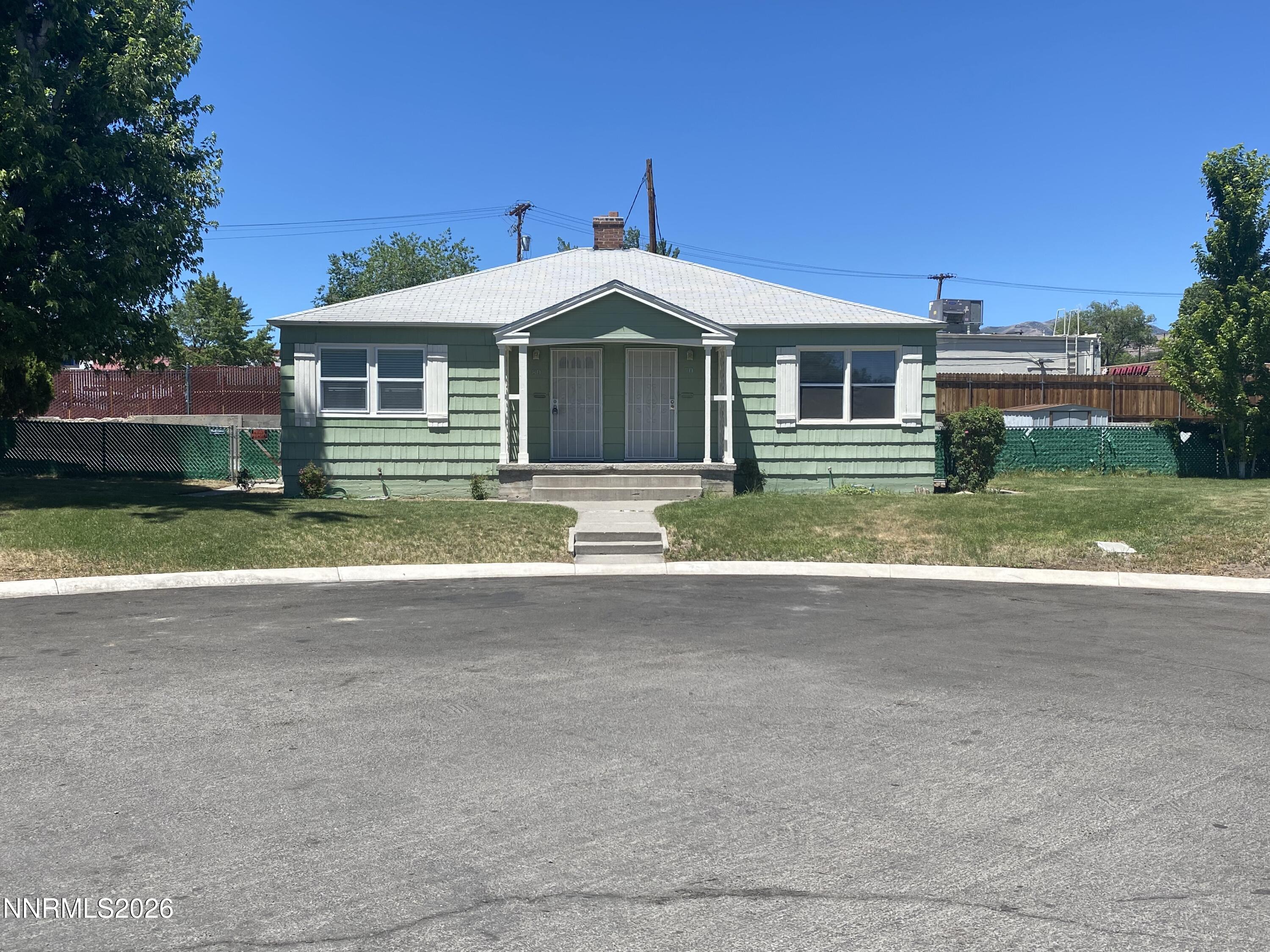 70 Arden Circle Reno, NV 89503 - Photo 1 of 15 a front view of house with yard and green space
