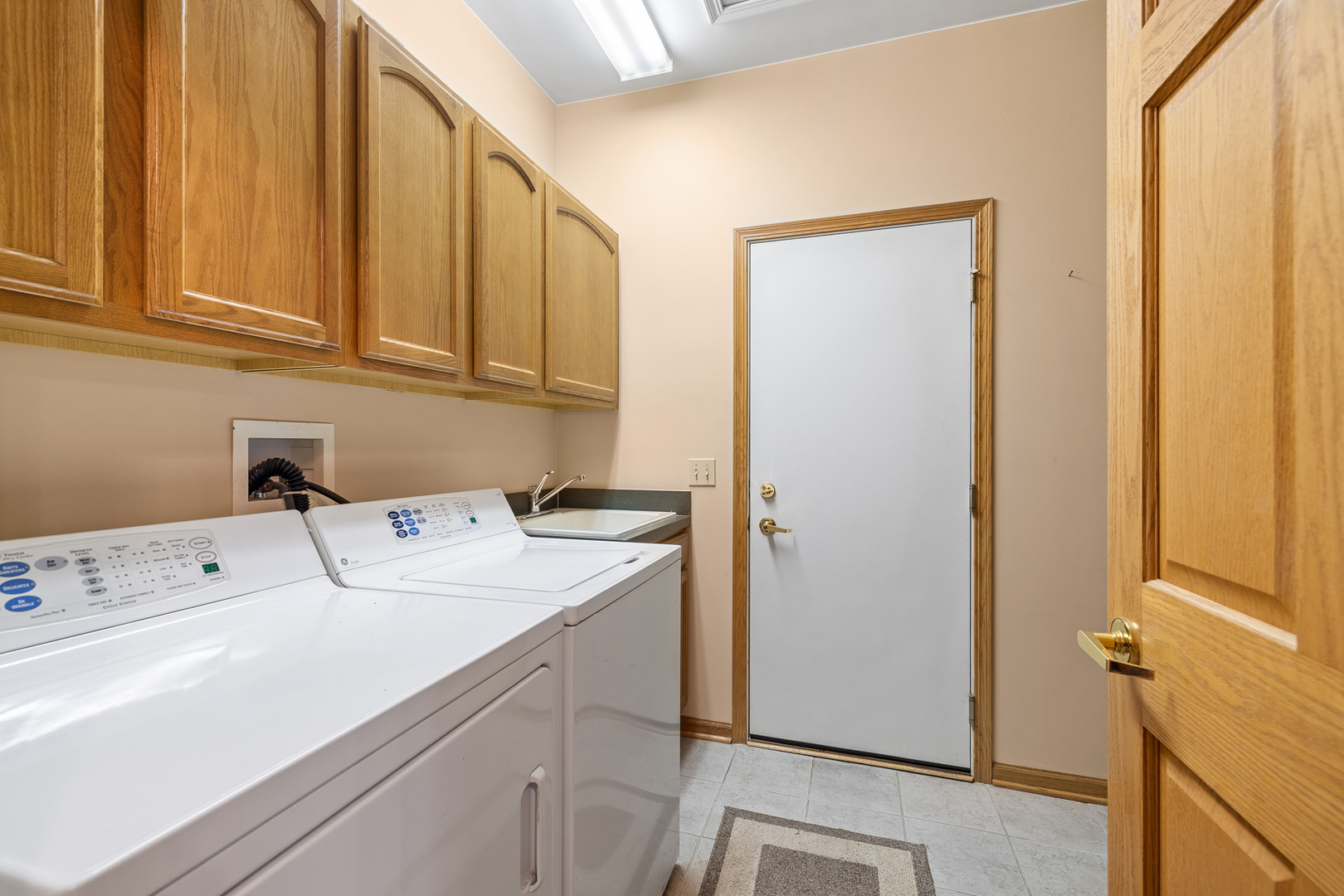 631 Saugatuk Circle Romeoville, IL 60446 - Photo 18 of 22 a utility room with dryer and washer