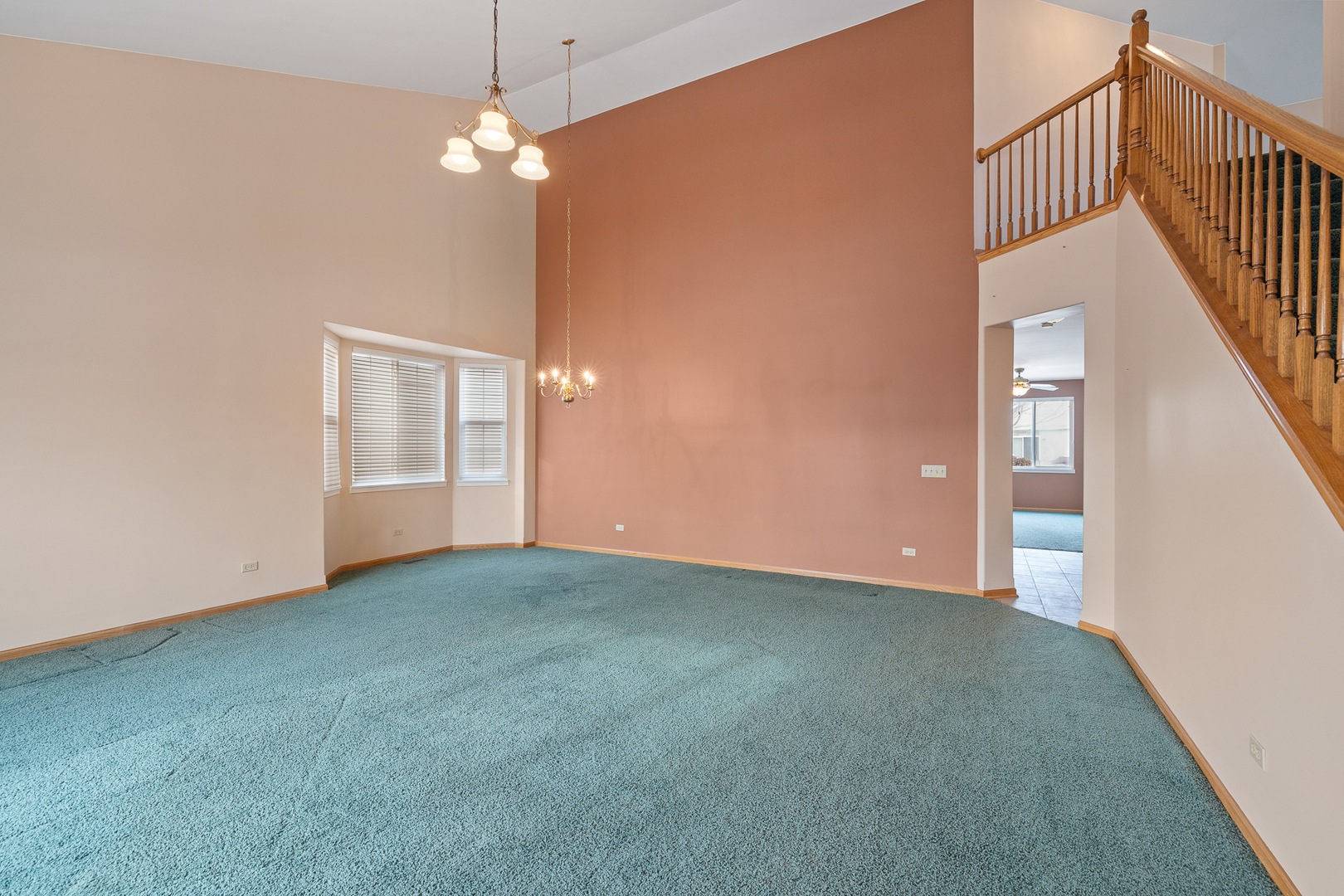 631 Saugatuk Circle Romeoville, IL 60446 - Photo 2 of 22 a view of an empty room with a chandelier fan