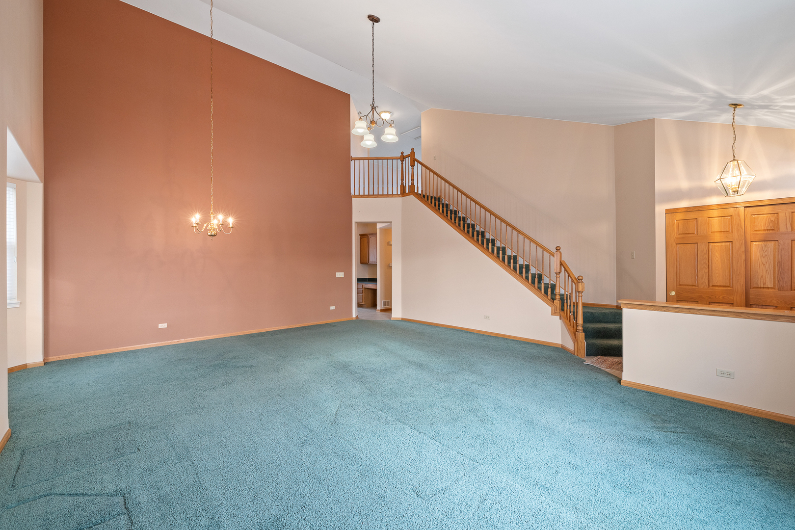 631 Saugatuk Circle Romeoville, IL 60446 - Photo 3 of 22 a view of a big room with windows and stairs