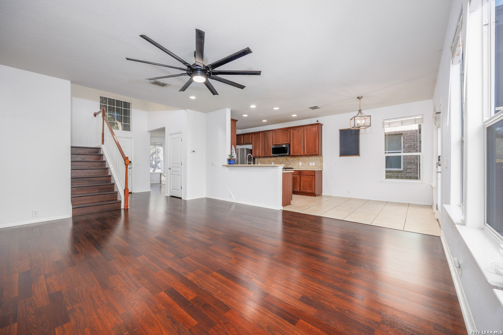 4702 Thomas Rusk San Antonio, TX 78253 - Photo 4 of 18 a view of a kitchen with wooden floor and a ceiling fan