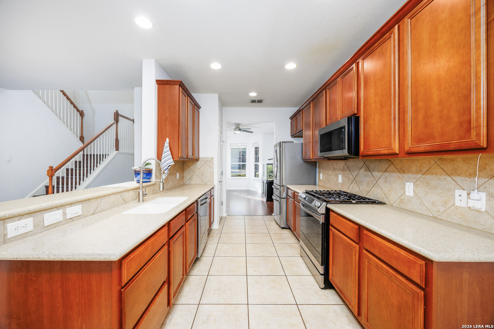 4702 Thomas Rusk San Antonio, TX 78253 - Photo 6 of 18 a large kitchen with stainless steel appliances granite countertop a sink and cabinets