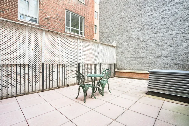 a view of a building with sitting area