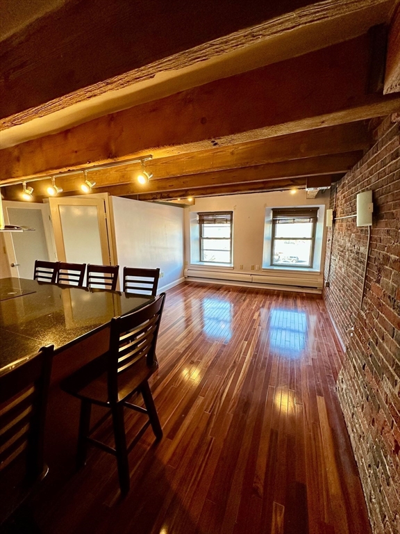 57 Fulton Street, Unit 11 Boston, MA 02109 - Photo 2 of 5 a view of empty room with wooden floor