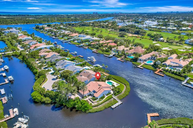 an aerial view of a houses with a lake view