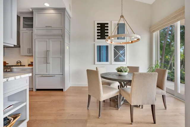 a spacious bedroom with a bed and a large window