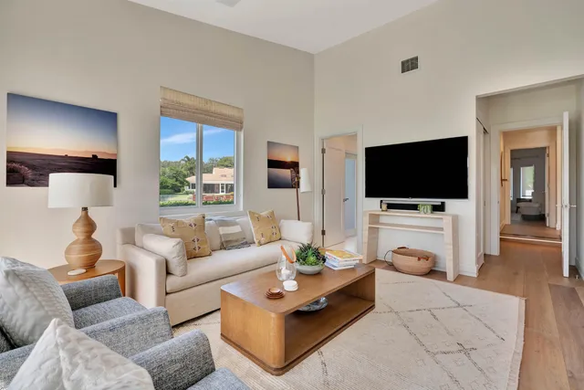 a bathroom with a granite countertop sink mirror and toilet